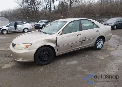 2003 Toyota Camry Le z USA, uszkodzony, nr VIN 4T1BE30KX3U231073